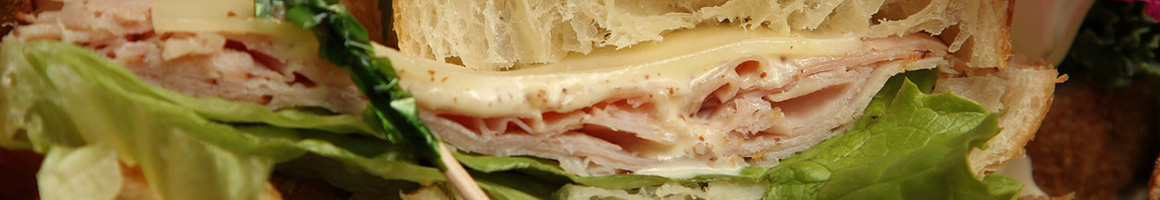 Eating Deli Sandwich at Lit'l Pepper Gourmet restaurant in San Diego, CA.